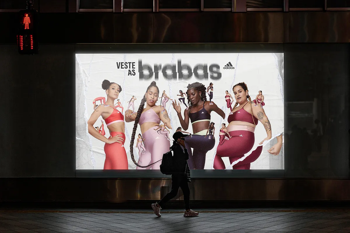 A advertising billboard showing four womans wearing adidas